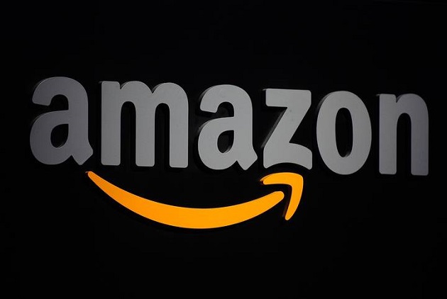 (FILES) -- A file photo taken on September 28, 2011 shows the Amazon logo seen on a podium during a press conference in New York. European Union anti-trust regulators have opened a probe into Internet shopping giant Amazon's tax arrangements with Luxembourg, which may amount to illegal state aid, the bloc said in a statement on October 7, 2014. AFP PHOTO/Emmanuel Dunand