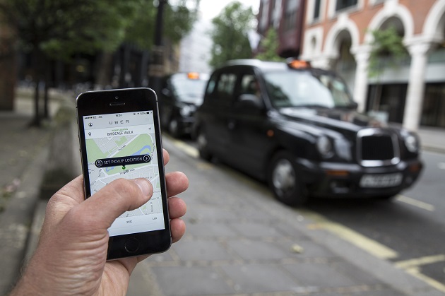 LONDON, ENGLAND - JUNE 02: In this photo illustration, a smartphone displays the 'Uber' mobile application which allows users to hail private-hire cars from any location on June 2, 2014 in London, England. The controversial piece of software, which is opposed by established taxi drivers, currently serves more than 100 cities in 37 countries. London's black cabs are seeking a High Court ruling on the claim that the Uber software is breaking the law by using an app as a taxi meter to determine rates. (Photo by Oli Scarff/Getty Images) ORG XMIT: 495663217 ORIG FILE ID: 495298219